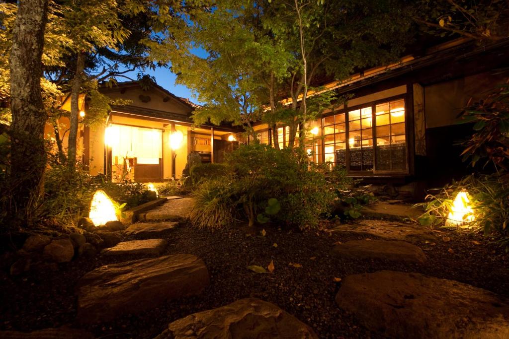 a house with lights in front of it at night at Wa no Yado Sagiritei in Yufu