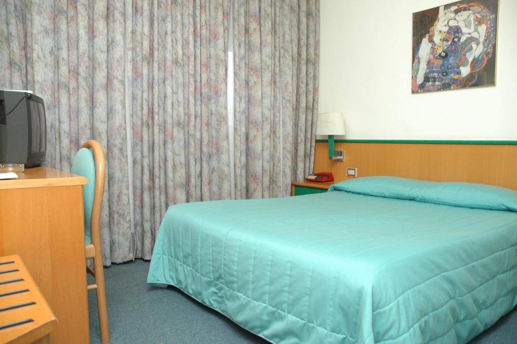 Postel nebo postele na pokoji v ubytování Hotel Ramoverde