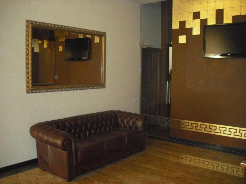 TV a/nebo společenská místnost v ubytování Hotel Rexton
