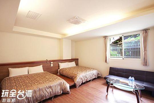 Postel nebo postele na pokoji v ubytování Shang Ti Sitou B&B