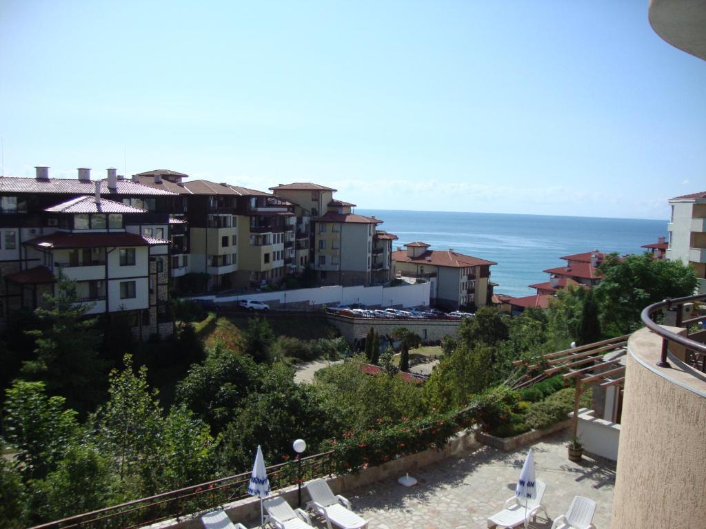 a view of a city with the ocean and buildings at Sirena Apartment in Sveti Vlas
