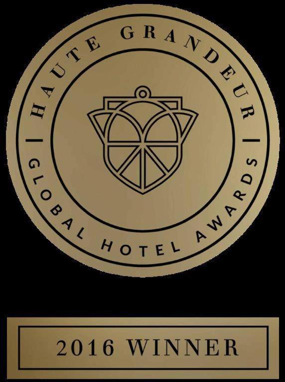 a logo for a hotel with the words newgrangled special hotelagency at The Eclipse Boutique Suites in Abu Dhabi