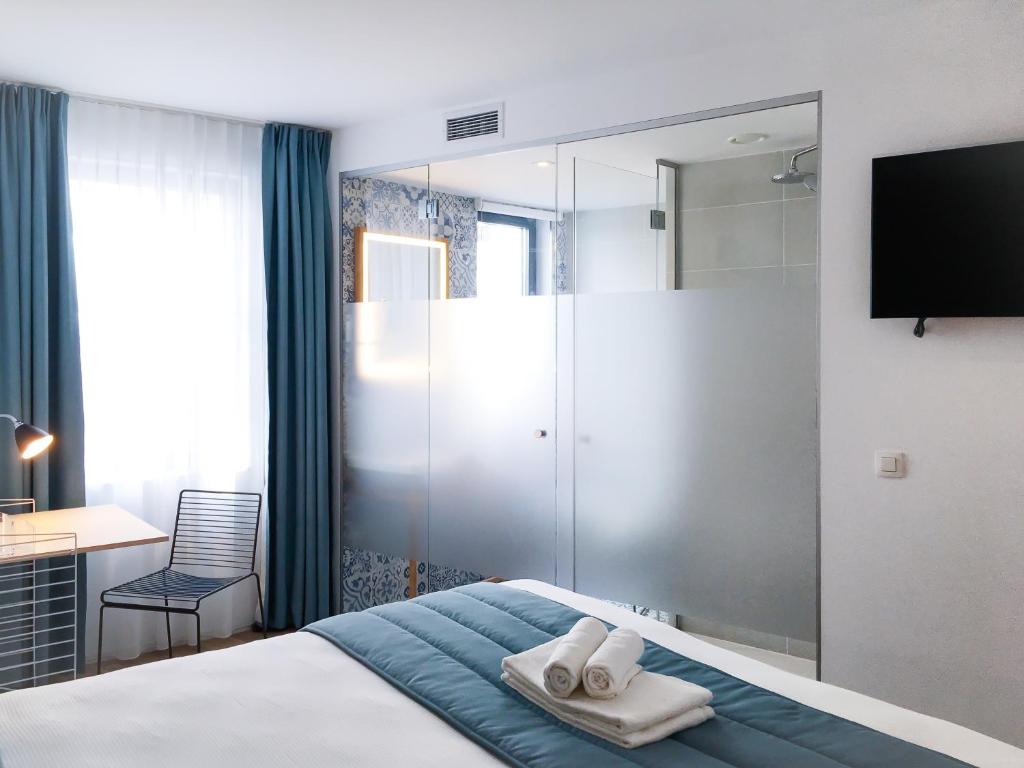 Postel nebo postele na pokoji v ubytování Hygge Hotel