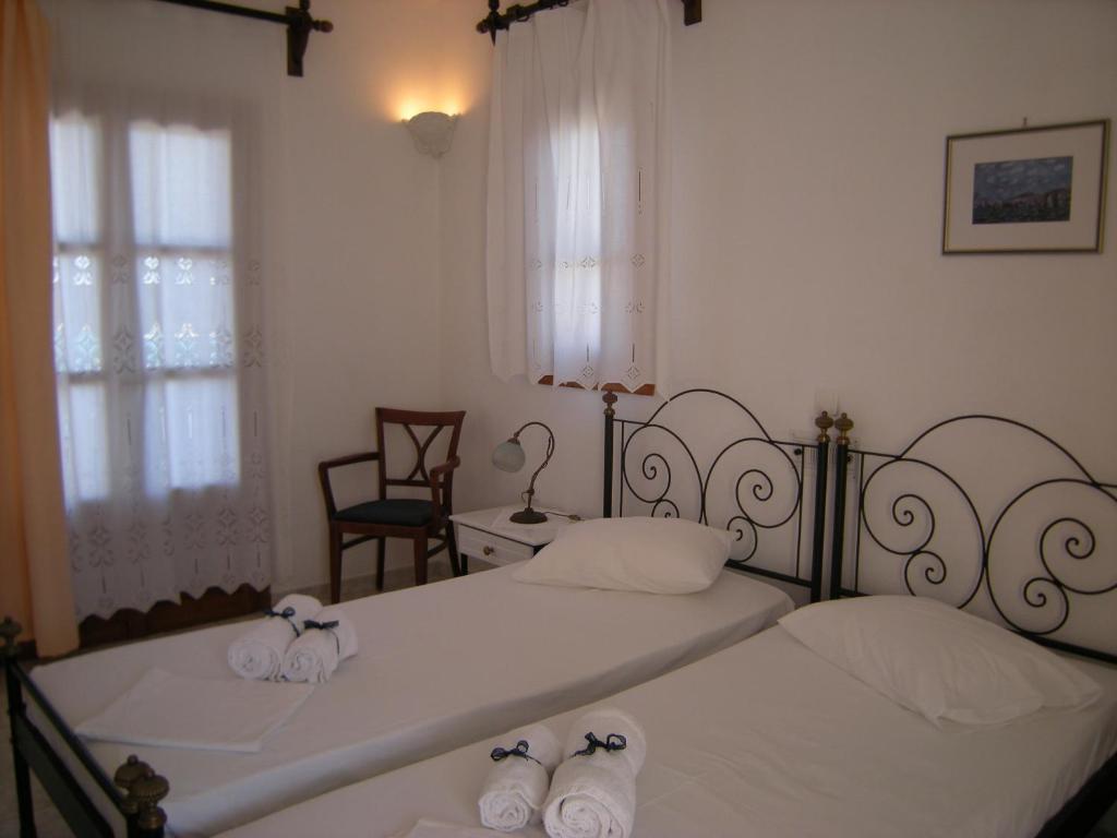 Postel nebo postele na pokoji v ubytování Roussos Beach Hotel