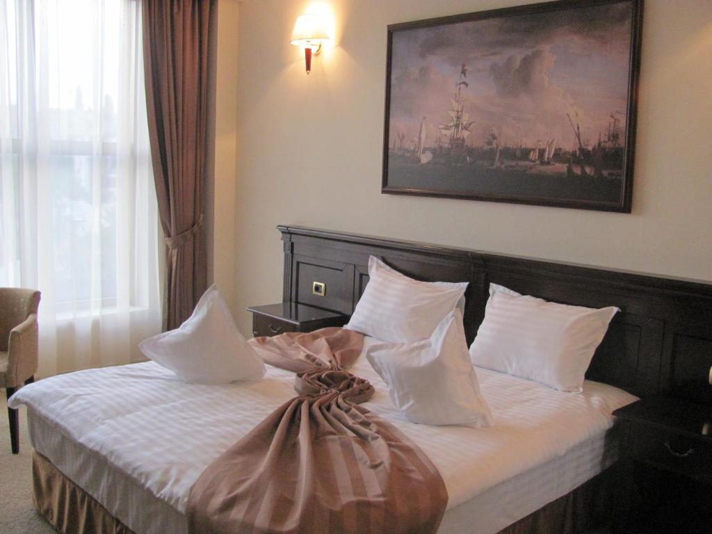 Postel nebo postele na pokoji v ubytování Hotel Rexton