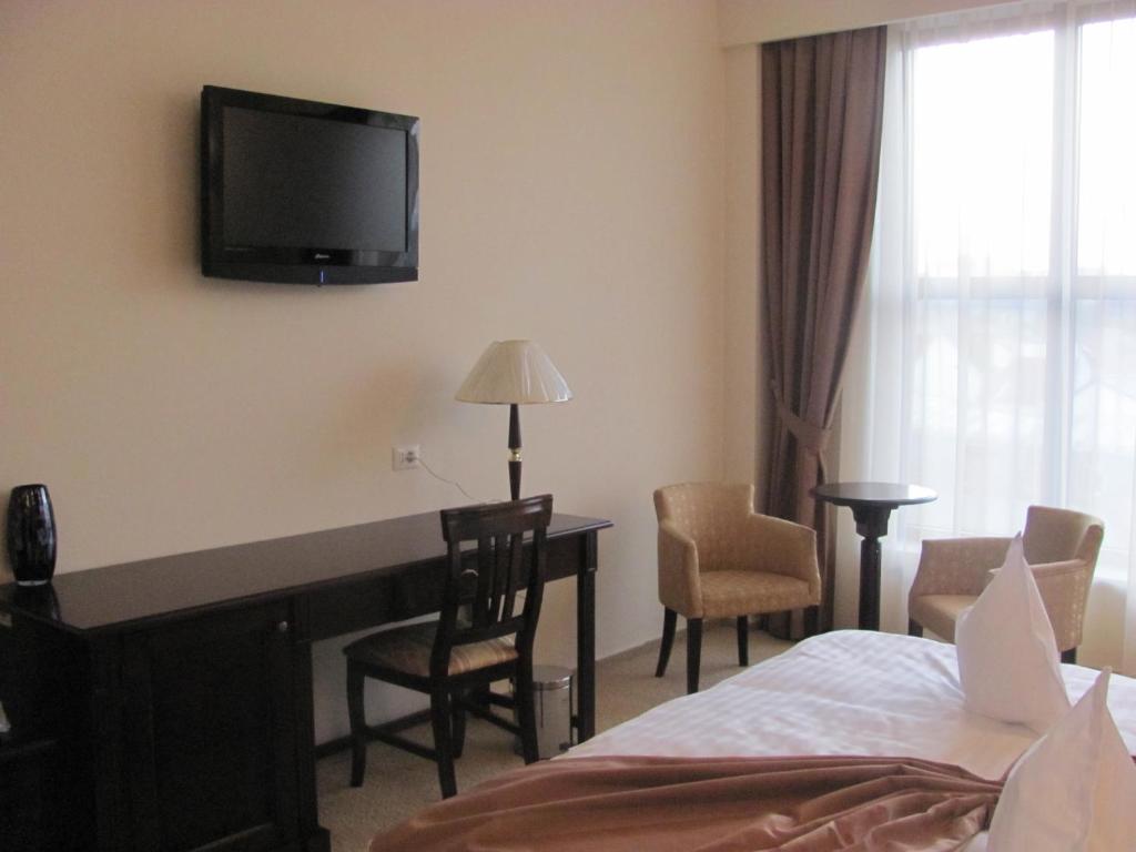 TV a/nebo společenská místnost v ubytování Hotel Rexton