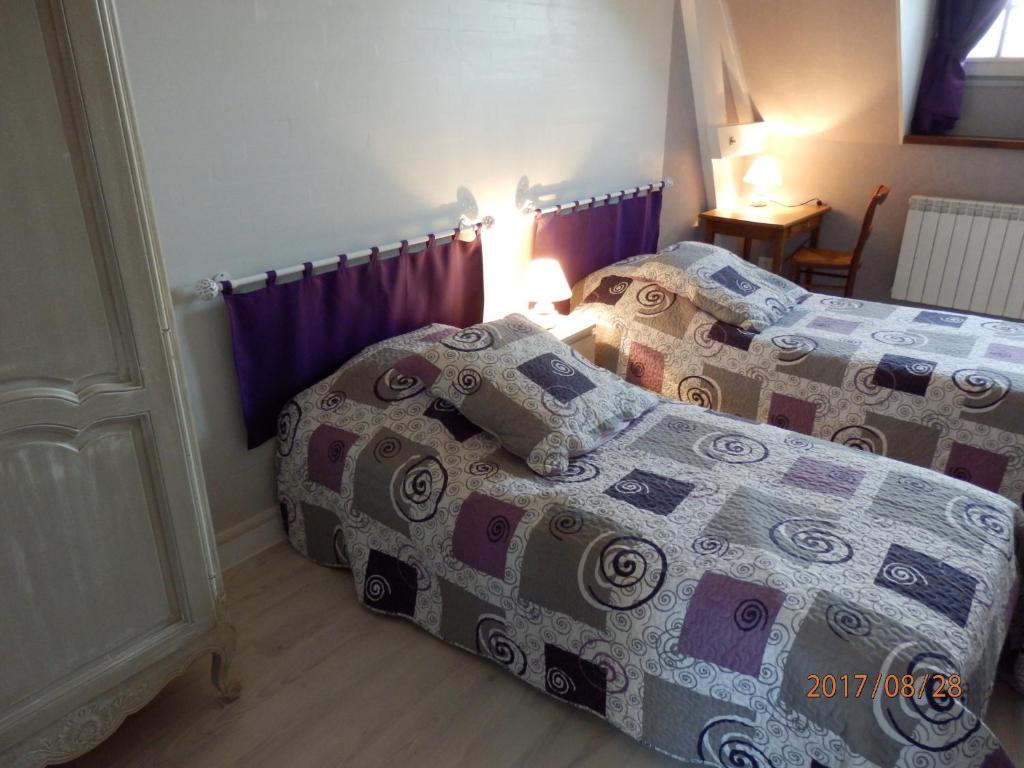 Postel nebo postele na pokoji v ubytování Manoir de Rouillé