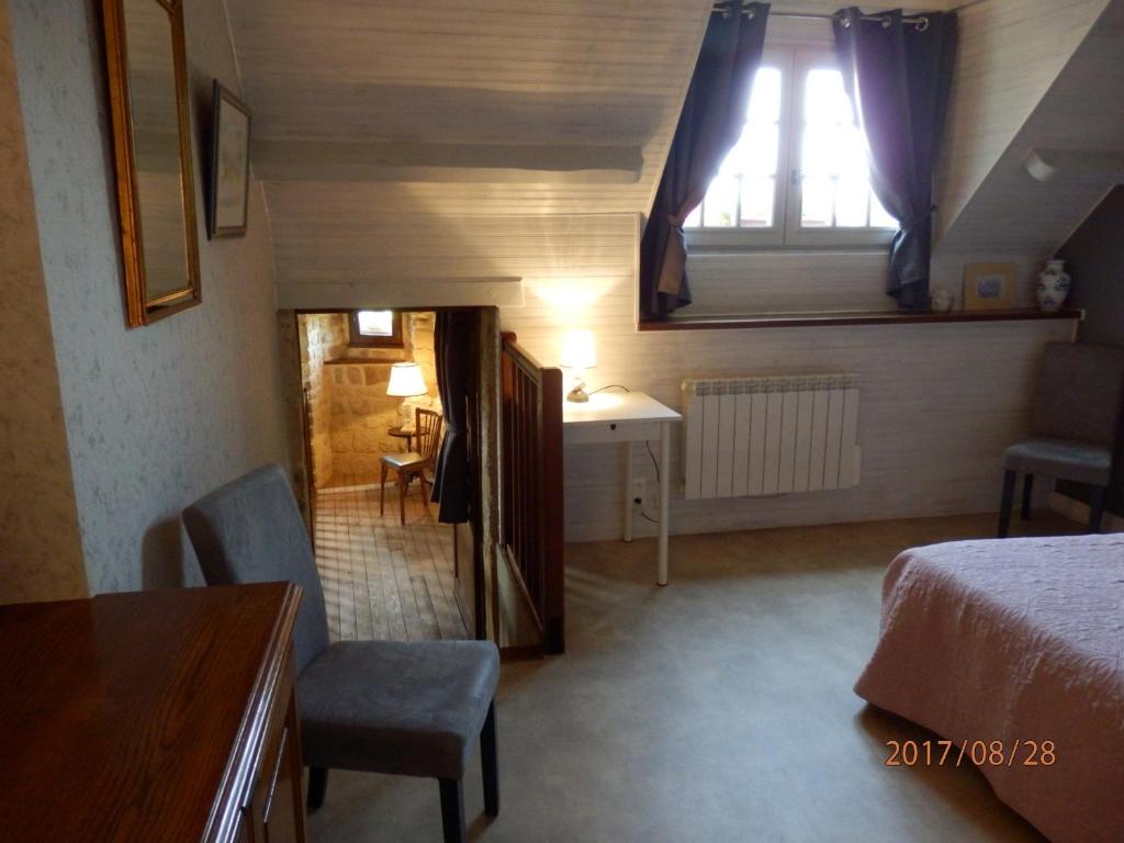 Postel nebo postele na pokoji v ubytování Manoir de Rouillé
