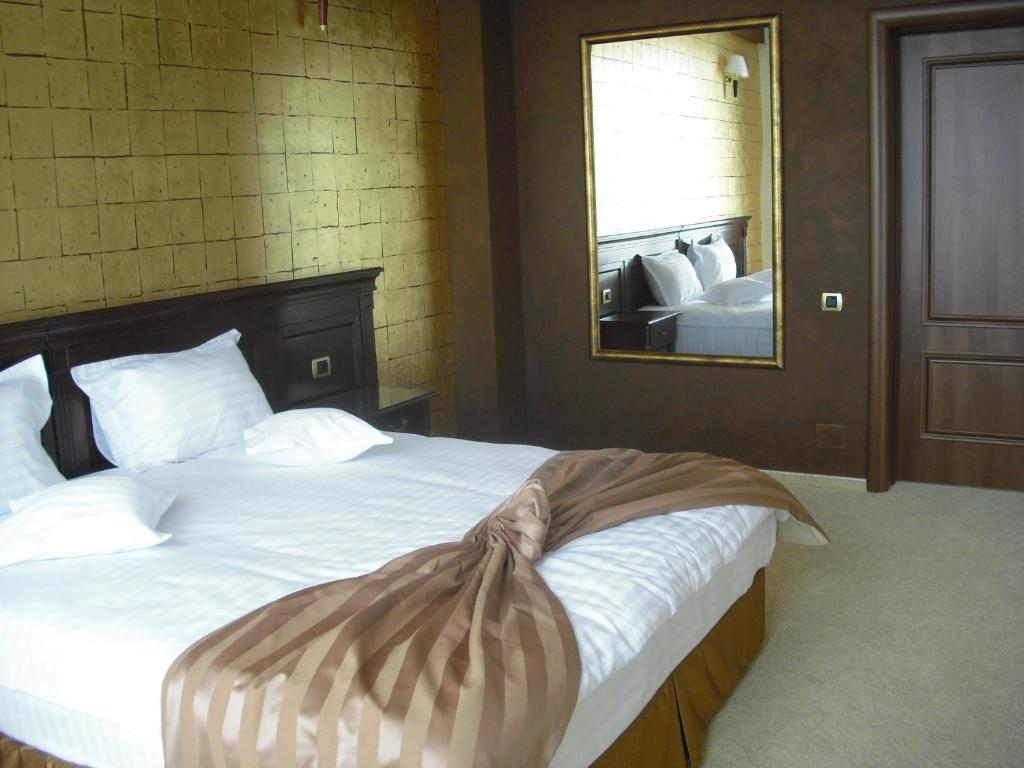 Postel nebo postele na pokoji v ubytování Hotel Rexton