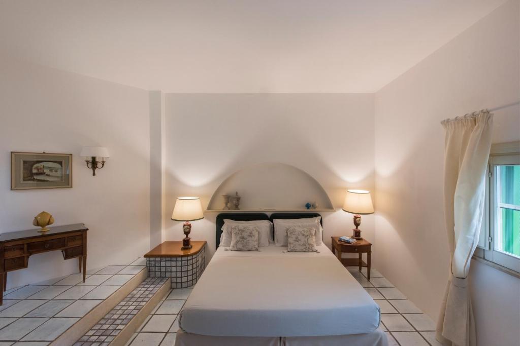 Postel nebo postele na pokoji v ubytování Masseria Il Melograno