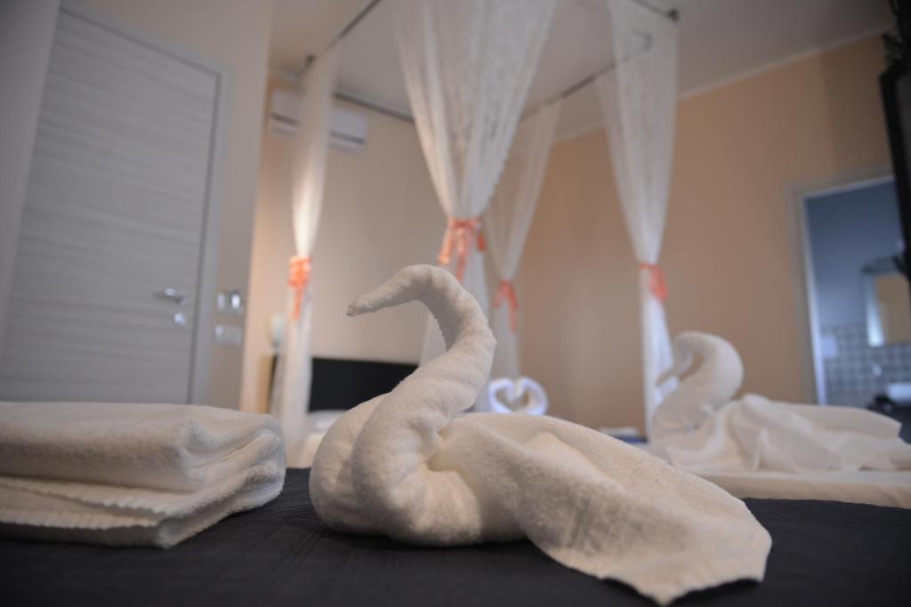 Postel nebo postele na pokoji v ubytování La Gioia di Sicilia B&B