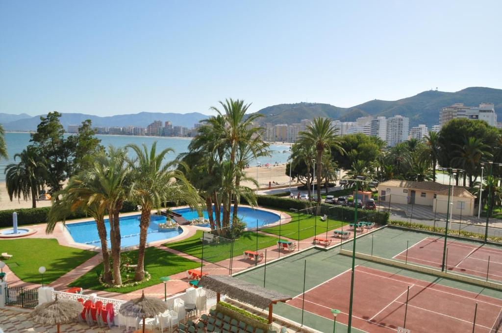 a view of a tennis court with palm trees at Palm Tree Cullera in Cullera