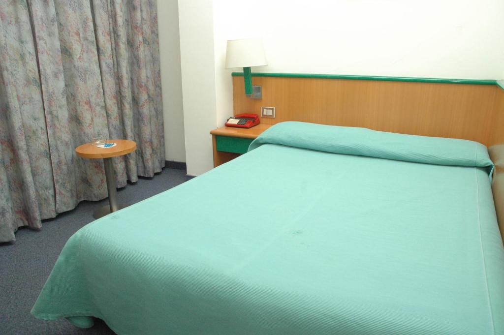 Postel nebo postele na pokoji v ubytování Hotel Ramoverde