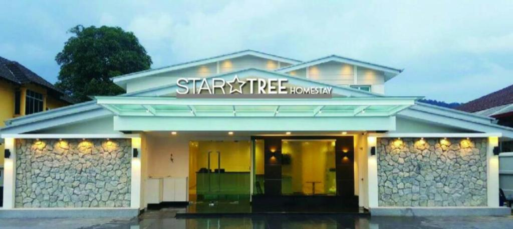 a starbucks building with a sign on top of it at Star Tree Homestay -Contactless Self Check in in Kuantan