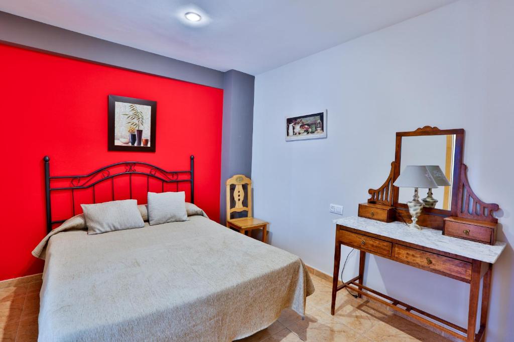 Łóżko lub łóżka w pokoju w obiekcie Apartamentos Castillo Cazorla