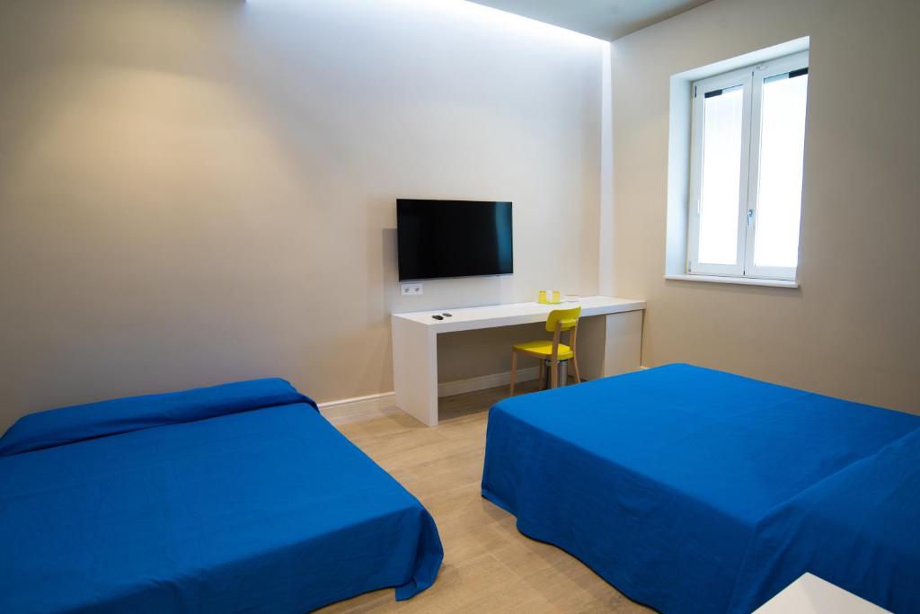 Televízia a/alebo spoločenská miestnosť v ubytovaní B & B REGINA MARGHERITA
