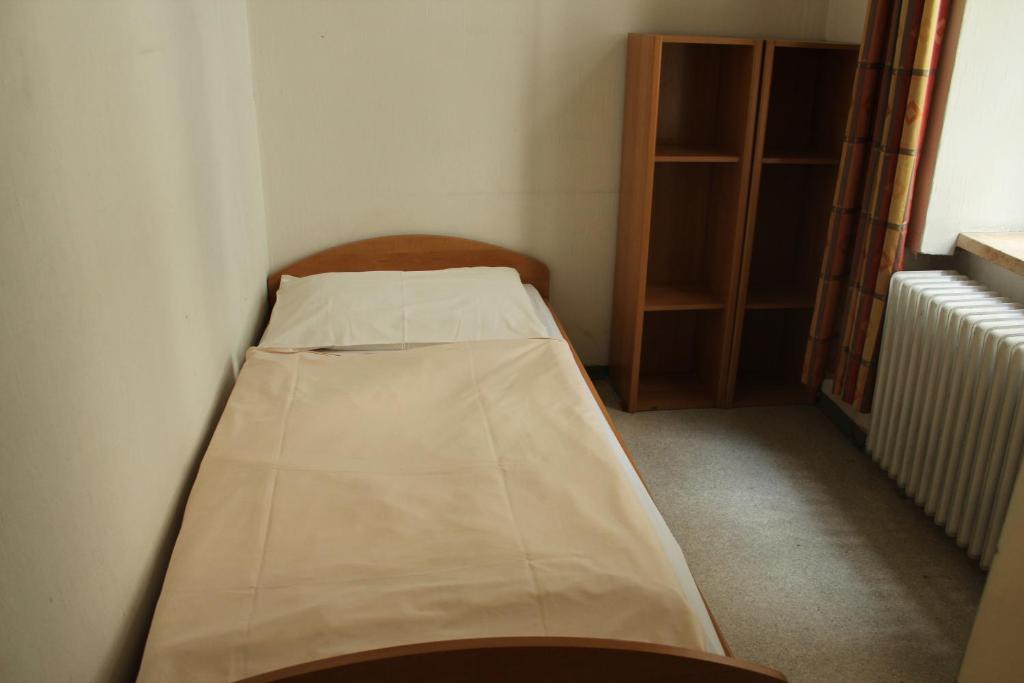 Postel nebo postele na pokoji v ubytování Porzellaneum