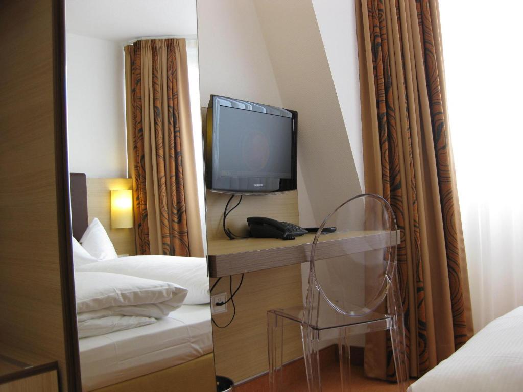 Postel nebo postele na pokoji v ubytování Hotel Flandrischer Hof