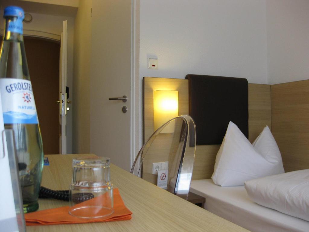 Postel nebo postele na pokoji v ubytování Hotel Flandrischer Hof