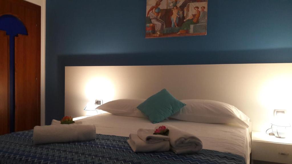 Łóżko lub łóżka w pokoju w obiekcie B&B Cornelia