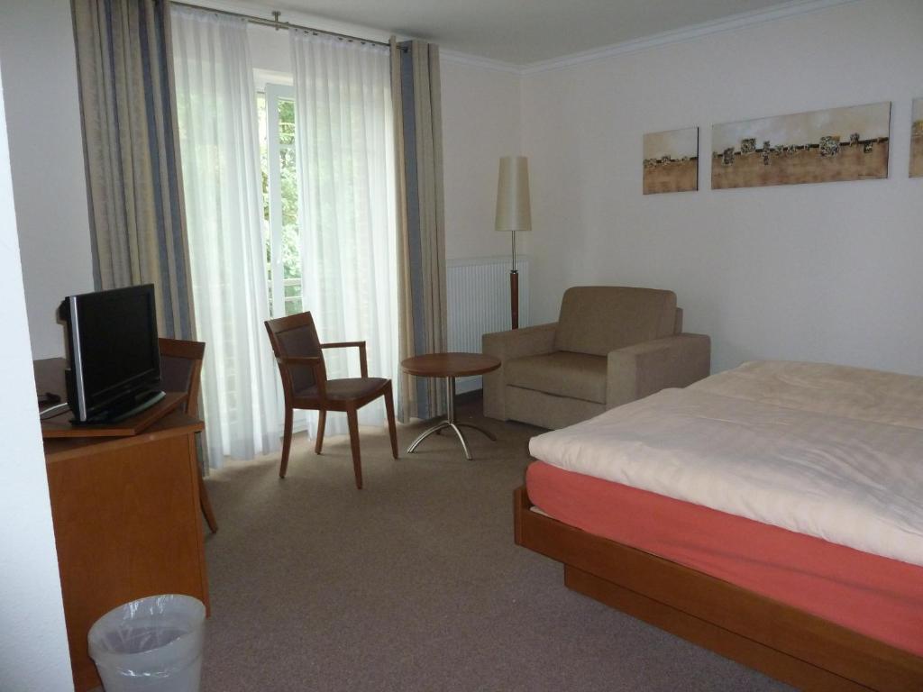 Кровать или кровати в номере Hotel Up de Birke