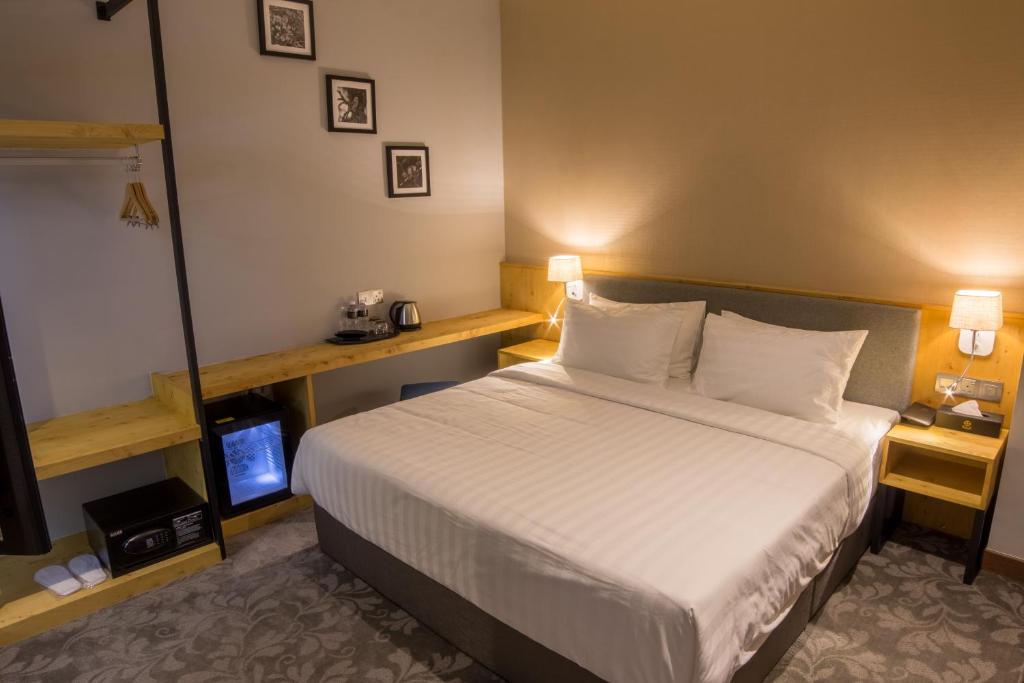 Postel nebo postele na pokoji v ubytování Redpine Boutique Hotel