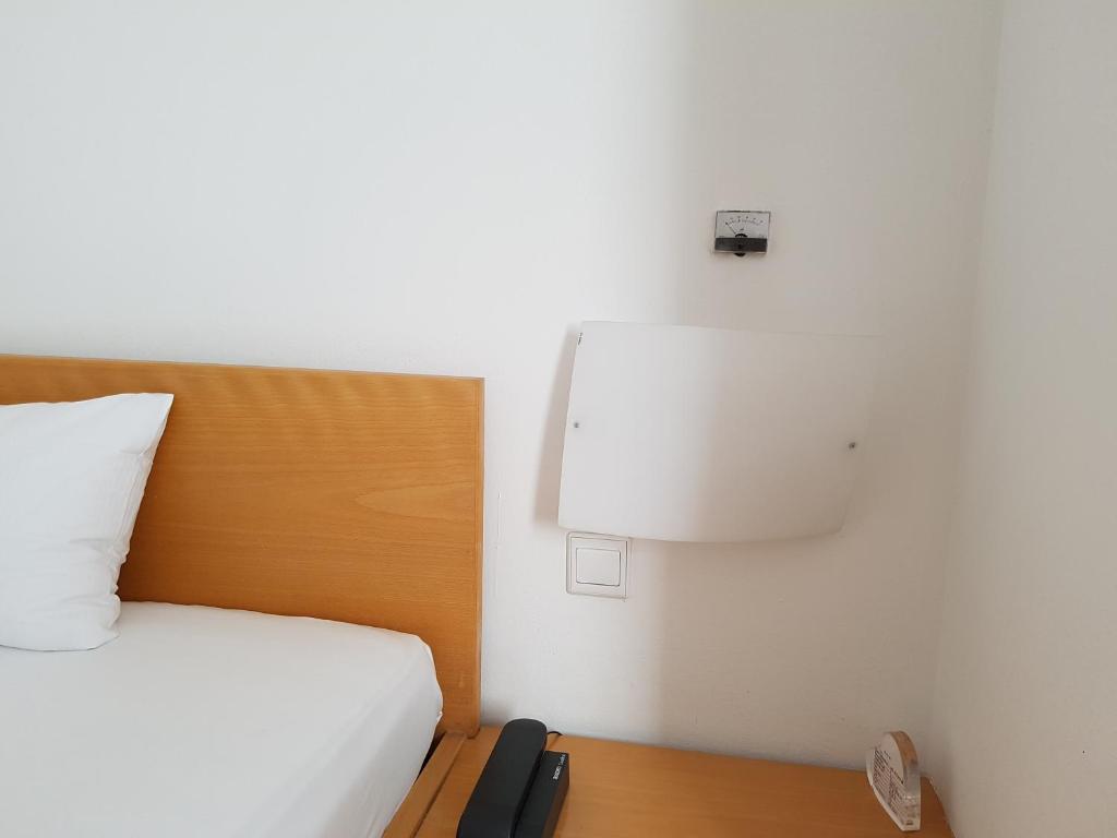 Postel nebo postele na pokoji v ubytování Art-Hotel Robert Mayer