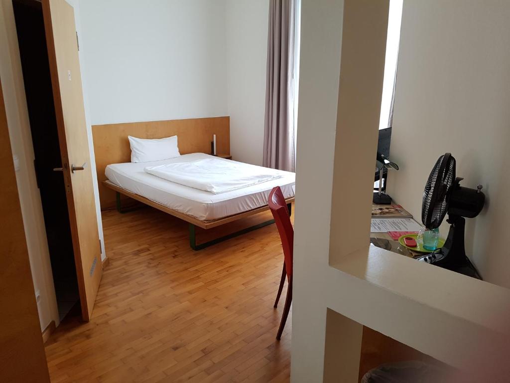 Postel nebo postele na pokoji v ubytování Art-Hotel Robert Mayer