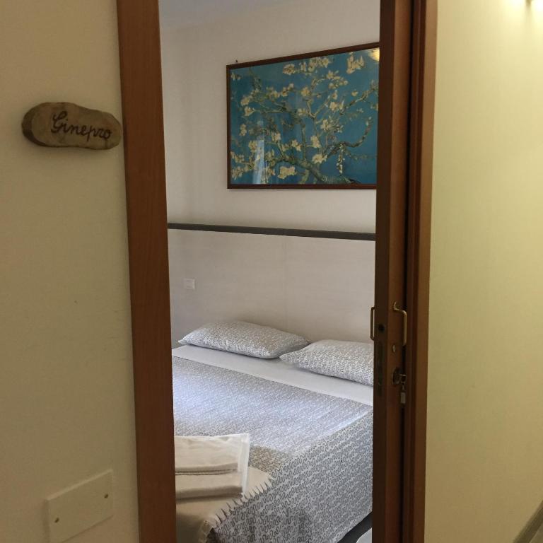 Postel nebo postele na pokoji v ubytování Colle Sul Lago