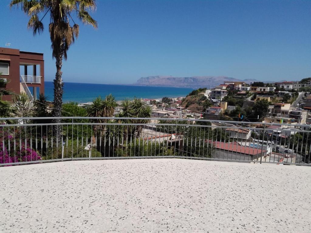 a view of the ocean from the balcony of a house at La Casa delle Ginestre in Alcamo Marina