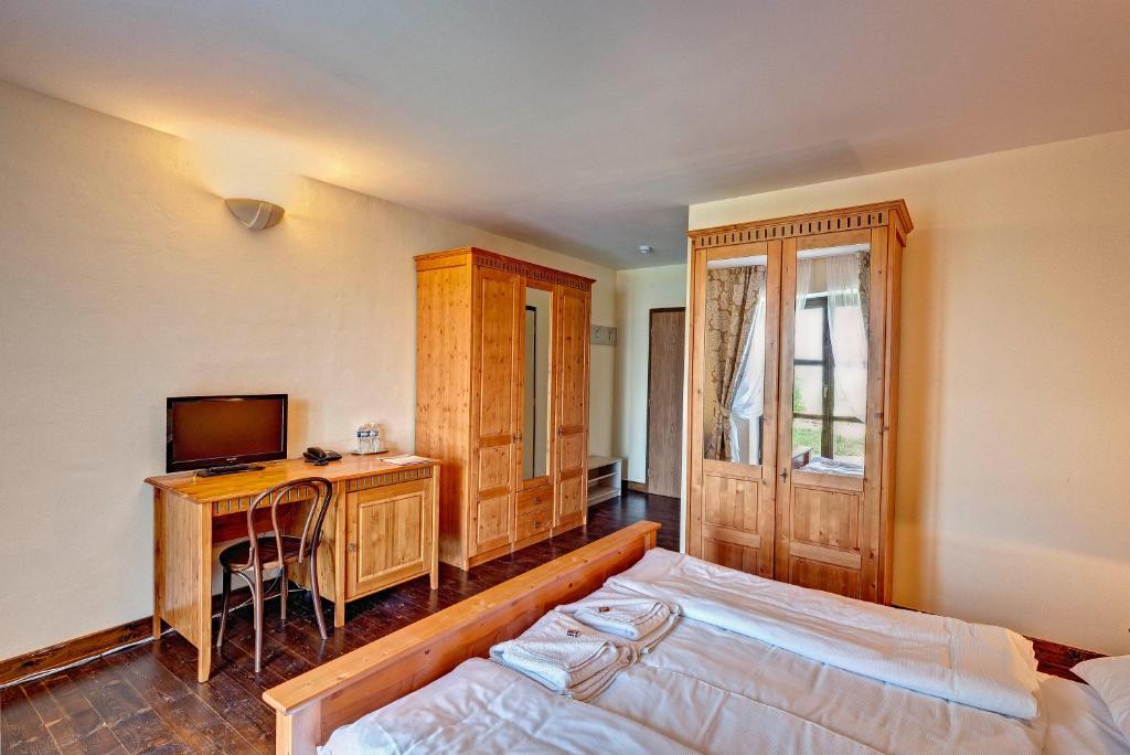 Postel nebo postele na pokoji v ubytování Hotel Buchlov