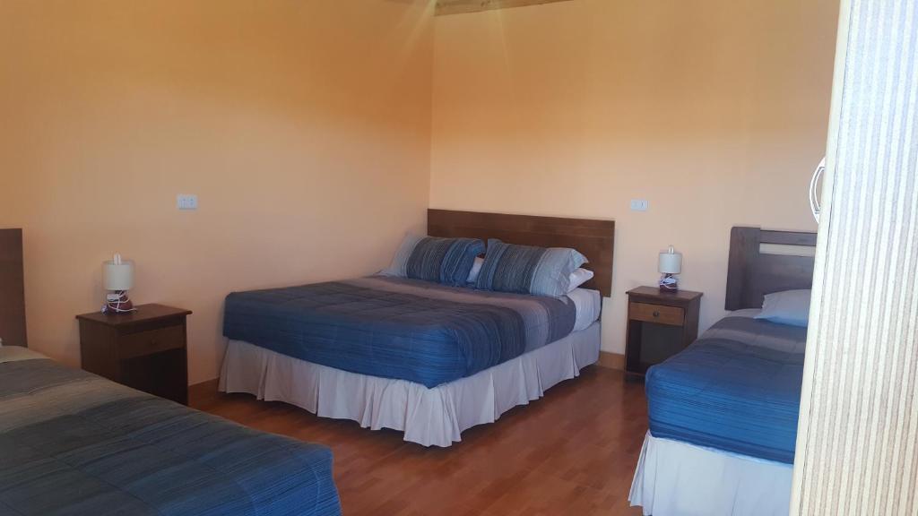 Postel nebo postele na pokoji v ubytování Hostal Mirador