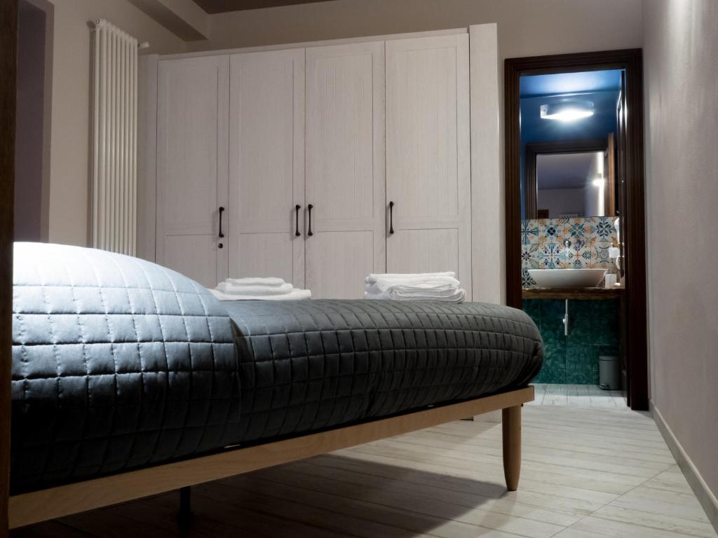 A bed or beds in a room at Casa vacanze Scurò - Isnello