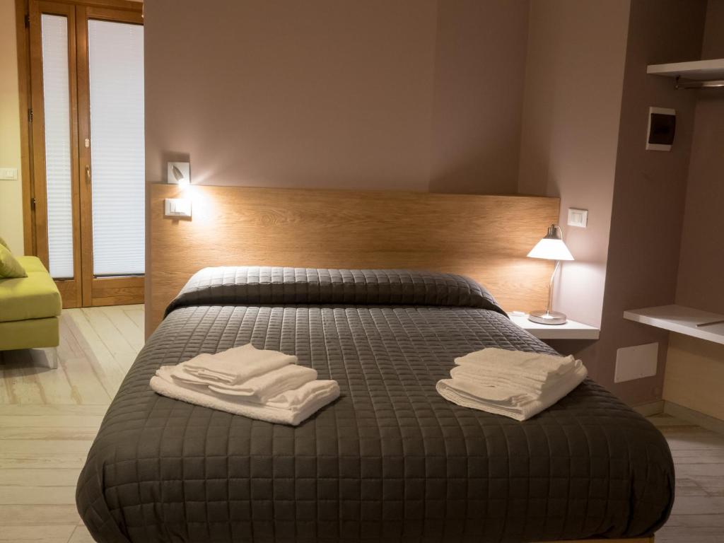 A bed or beds in a room at Casa vacanze Scurò - Isnello