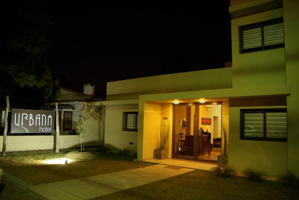 a house at night with the door lit up at Hotel Urbana in Córdoba