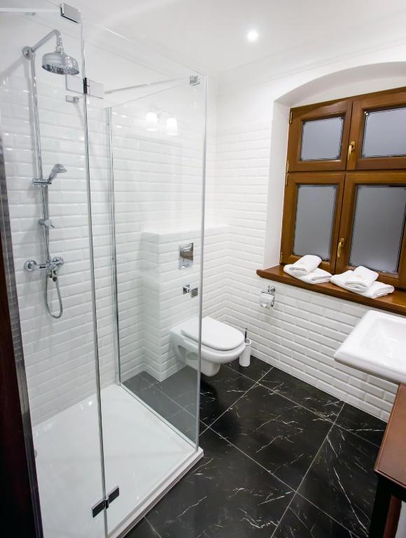 Koupelna v ubytování HG Hotel