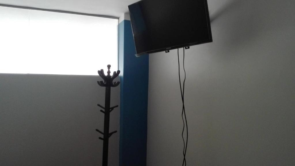 TV a/nebo společenská místnost v ubytování Hostel Puno Backpackers