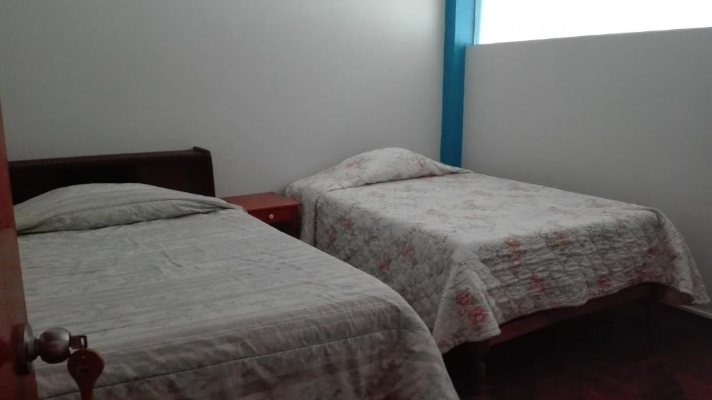Postel nebo postele na pokoji v ubytování Hostel Puno Backpackers