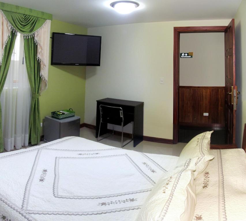 Postel nebo postele na pokoji v ubytování Apartahotel Vincent Suites