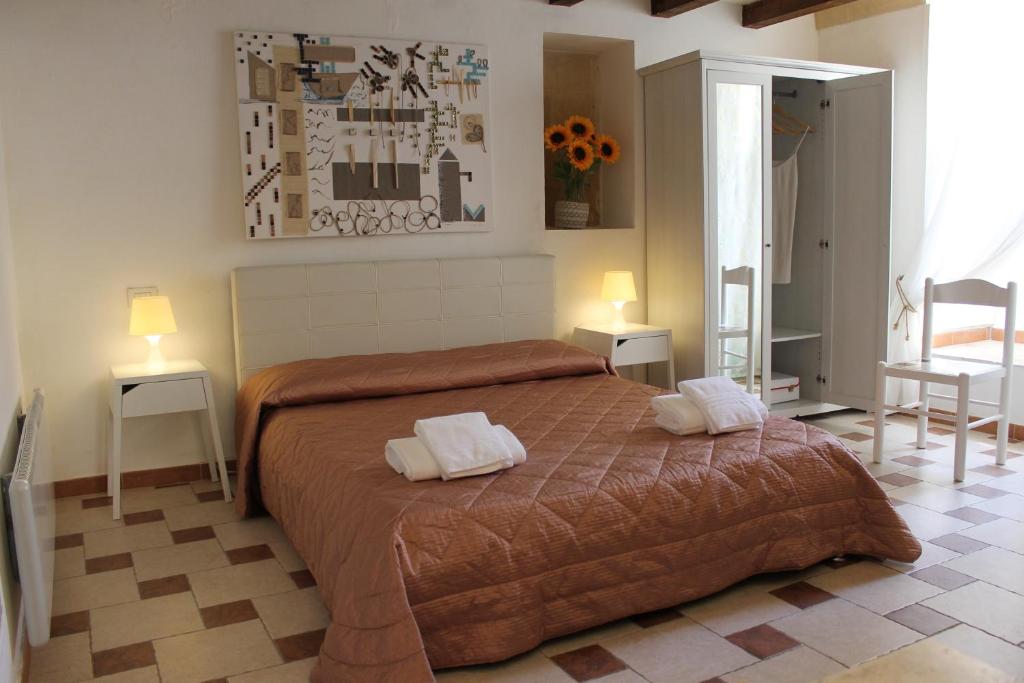 Ένα ή περισσότερα κρεβάτια σε δωμάτιο στο Casa vacanza L'antico fontanino
