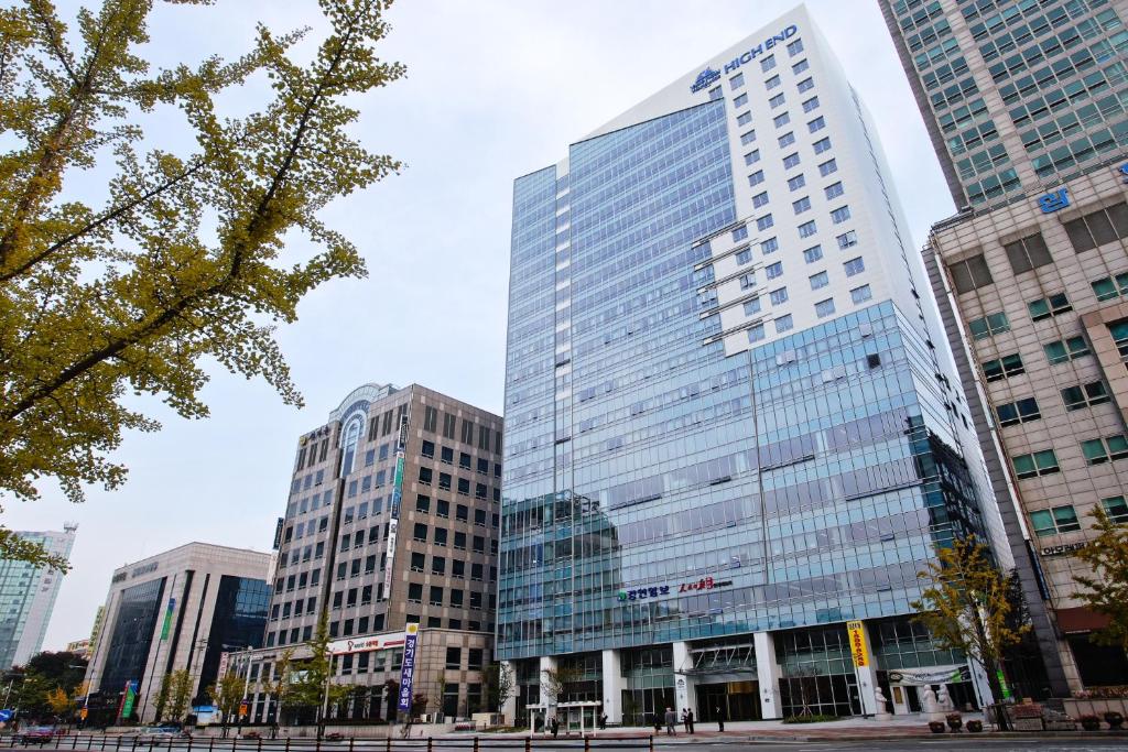 a group of tall buildings in a city at Haeden Hotel High End Suwon in Suwon