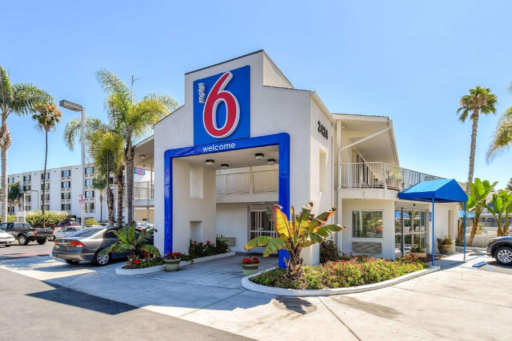 a hotel with a no sign in a parking lot at Motel 6-San Diego, CA - Hotel Circle - Mission Valley in San Diego