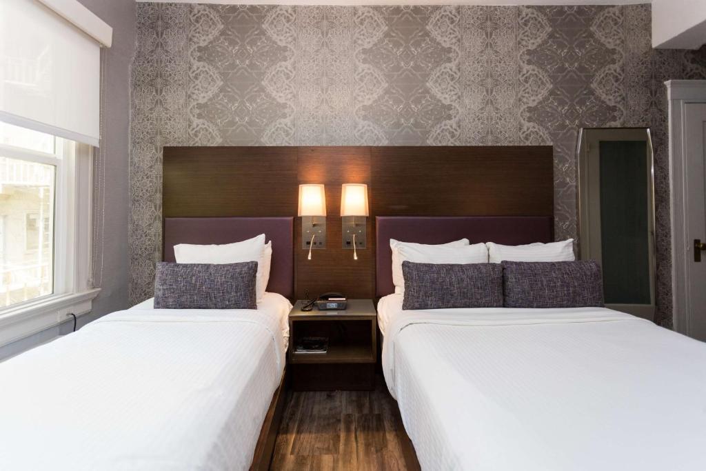 En eller flere senge i et værelse på Cartwright Hotel Union Square - BW Premier Collection