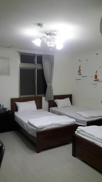 Postel nebo postele na pokoji v ubytování Home run Homestay
