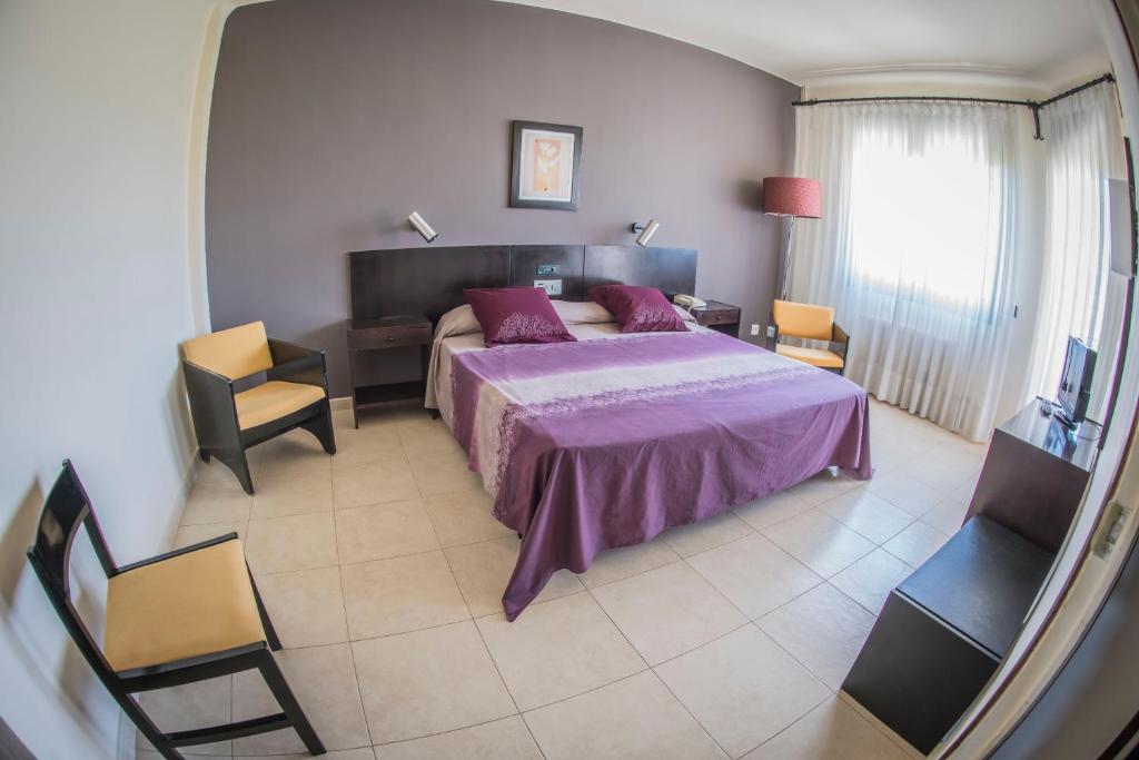 Postel nebo postele na pokoji v ubytování Hotel Gran Sol