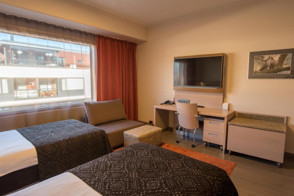 Postel nebo postele na pokoji v ubytování Original Sokos Hotel Vaakuna Joensuu