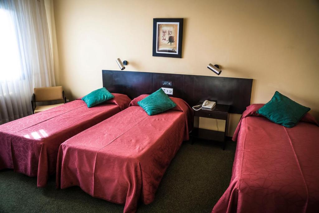 Postel nebo postele na pokoji v ubytování Hotel Gran Sol