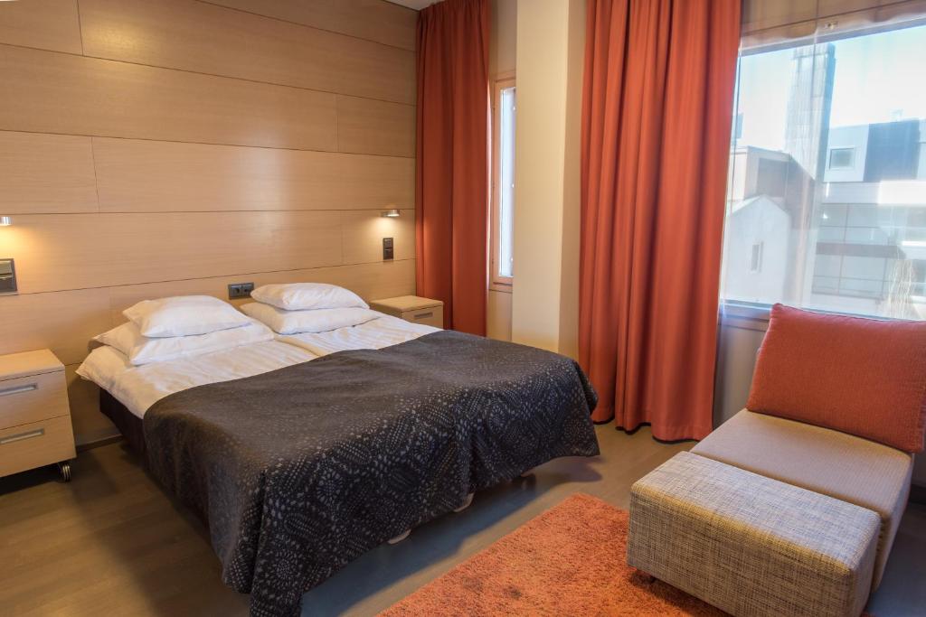 Postel nebo postele na pokoji v ubytování Original Sokos Hotel Vaakuna Joensuu