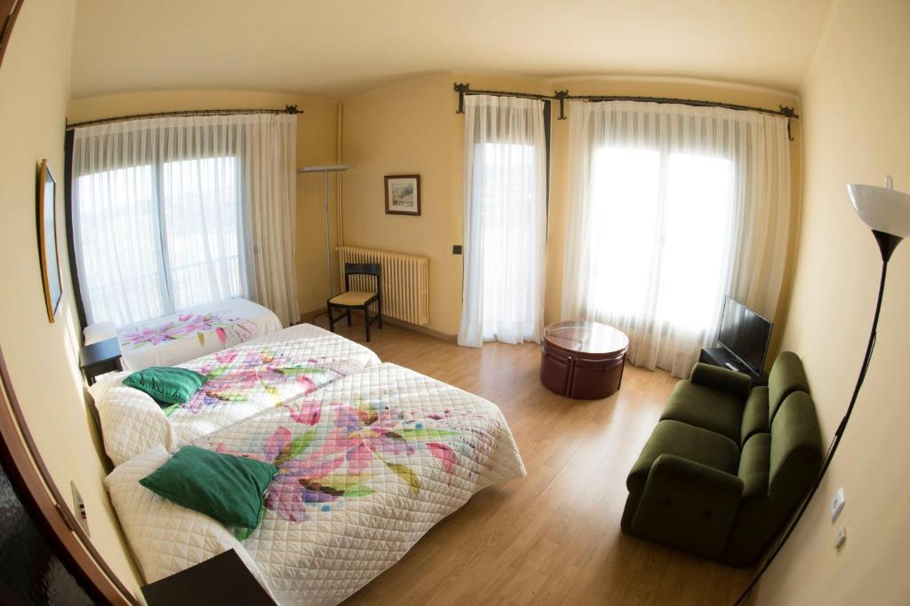 Postel nebo postele na pokoji v ubytování Hotel Gran Sol