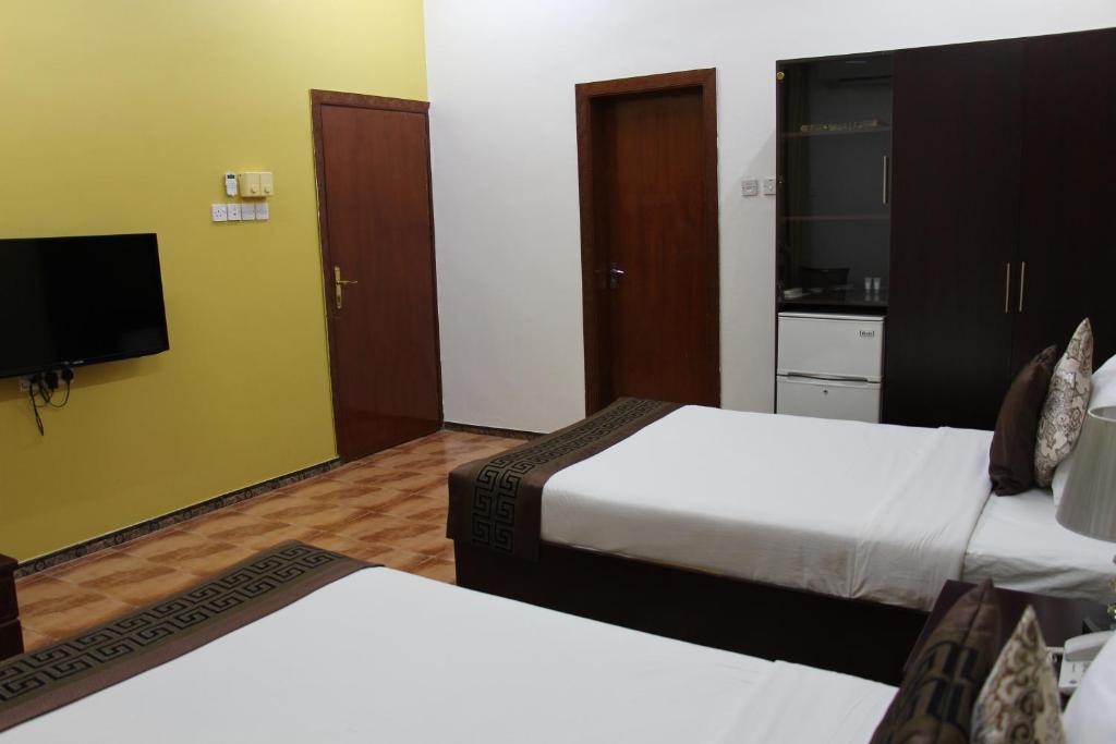 Postel nebo postele na pokoji v ubytování Majan Guest House L.L.C.